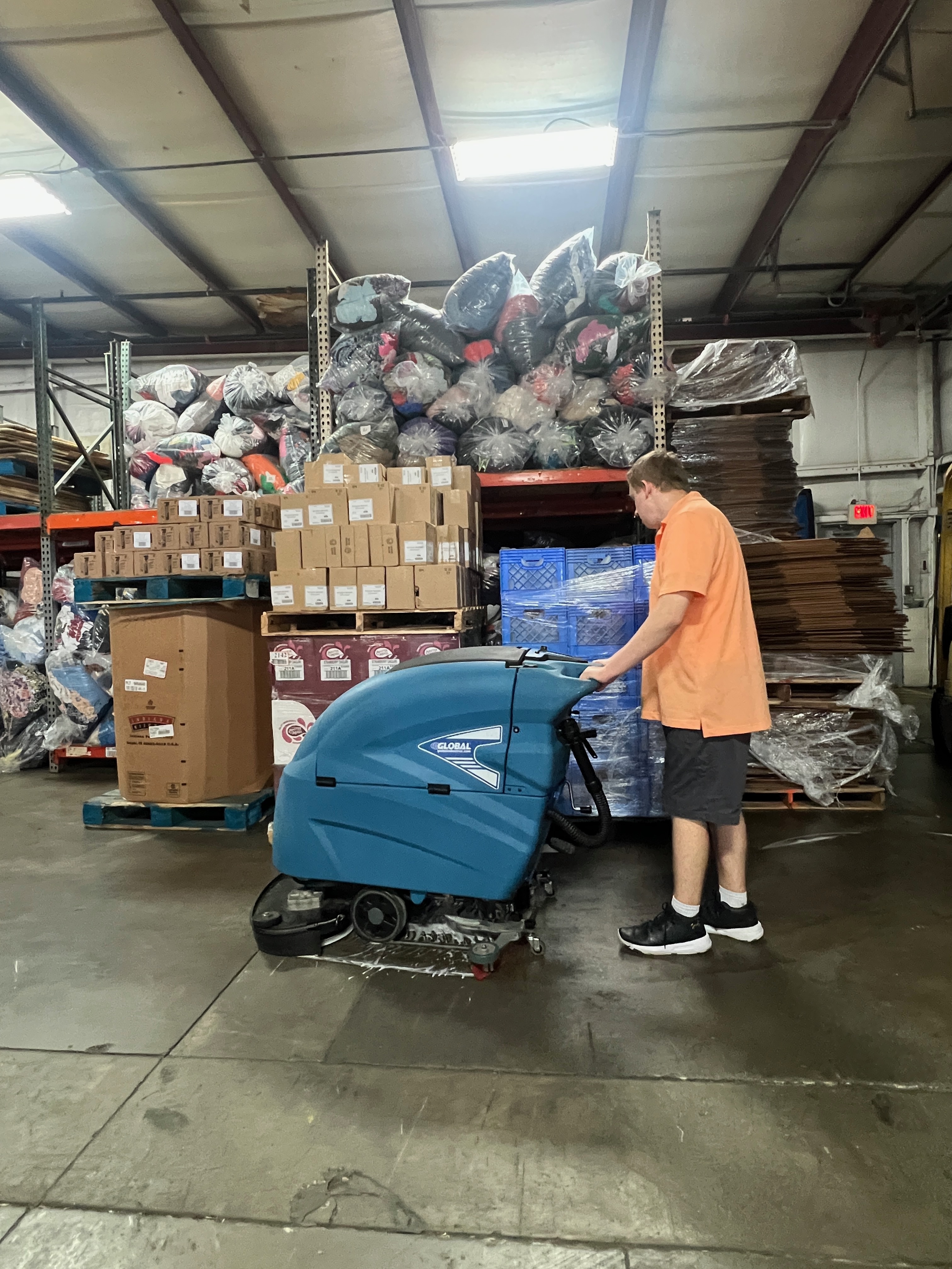 Landon Using Floor Scrubber at Master Provisions